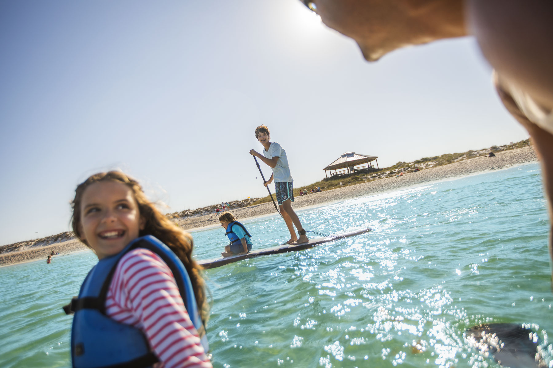 Family Paddle Boarding in Ocean