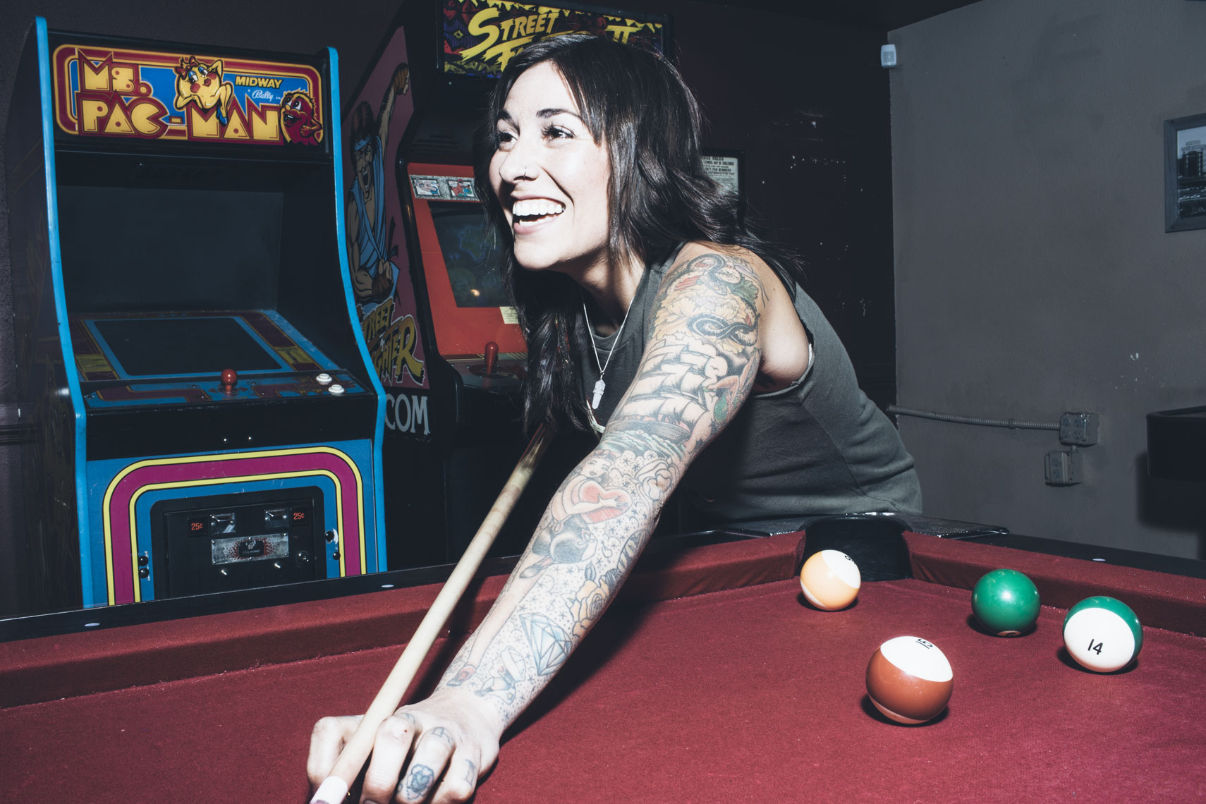 Tattooed Girl Playing Pool