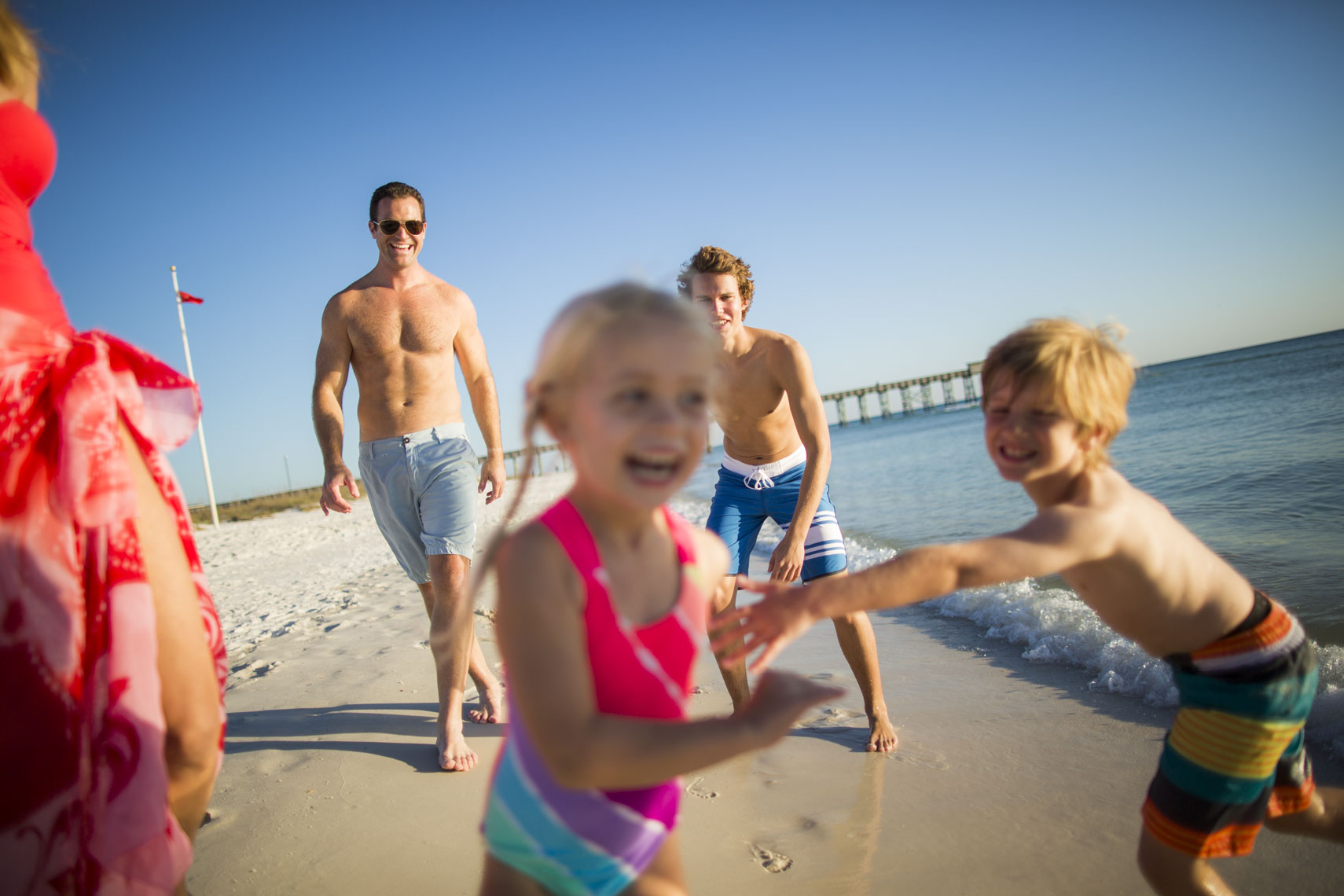 Family Walking On Beach